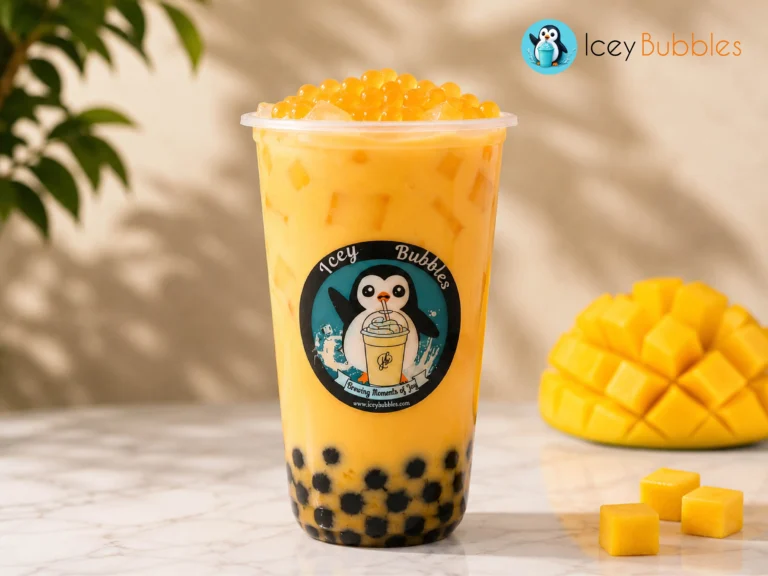 Bright mango bubble tea topped with orange popping boba, mango jelly, and tapioca pearls at Icey Bubbles in Ajax