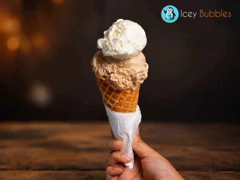 Hand holding a double scoop Italian gelato waffle cone at Icey Bubbles in Ajax, Ontario